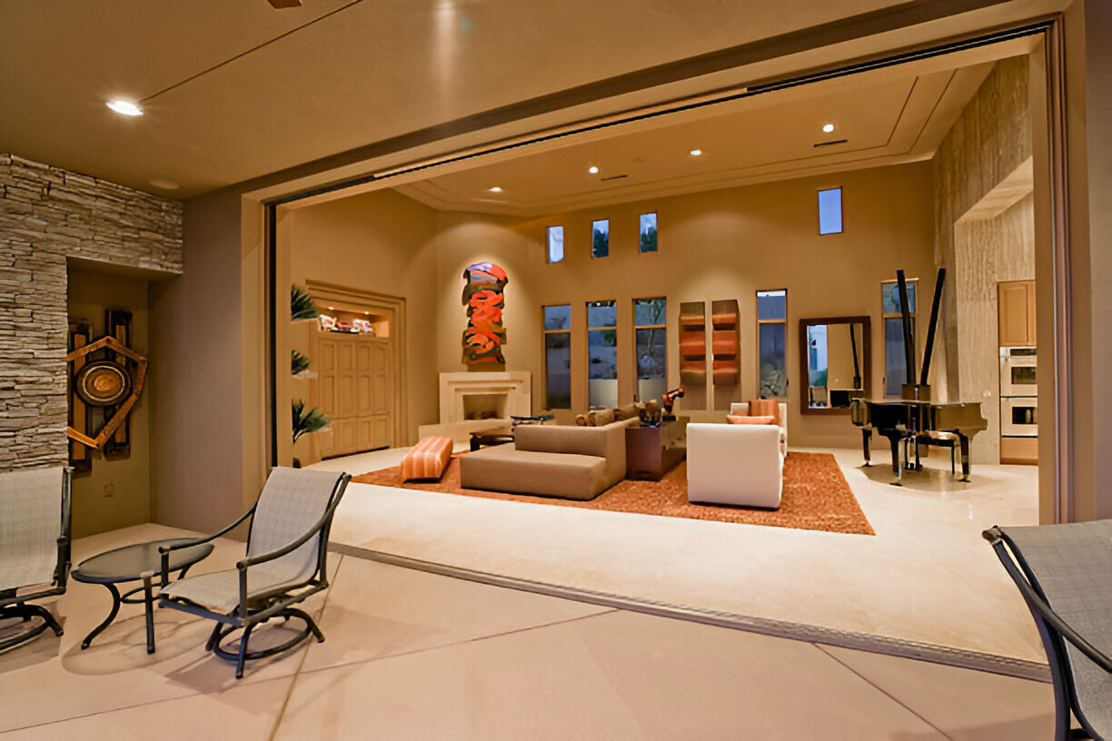 Elegant open-concept living room with indoor-outdoor transition and modern décor