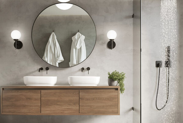 A luxurious bathroom with a large, glass-enclosed shower, double vanity sinks, and a sleek, floating vanity cabinet. The room features a neutral color palette, round mirrors, and modern lighting fixtures