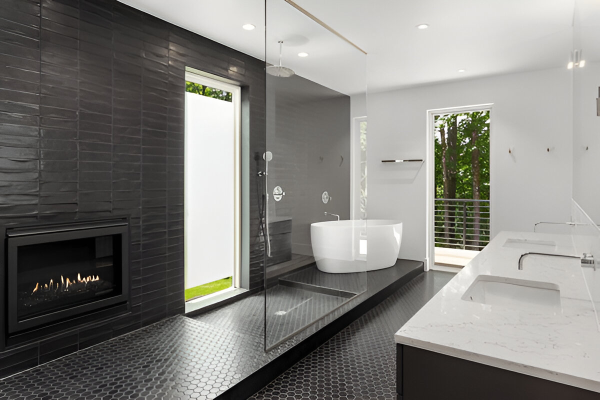 Modern black and white bathroom with freestanding tub and fireplace 