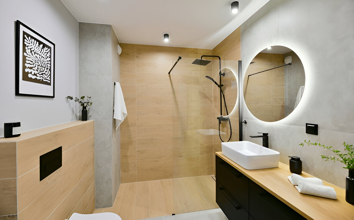 Modern minimalist bathroom with black fixtures and wood accents 