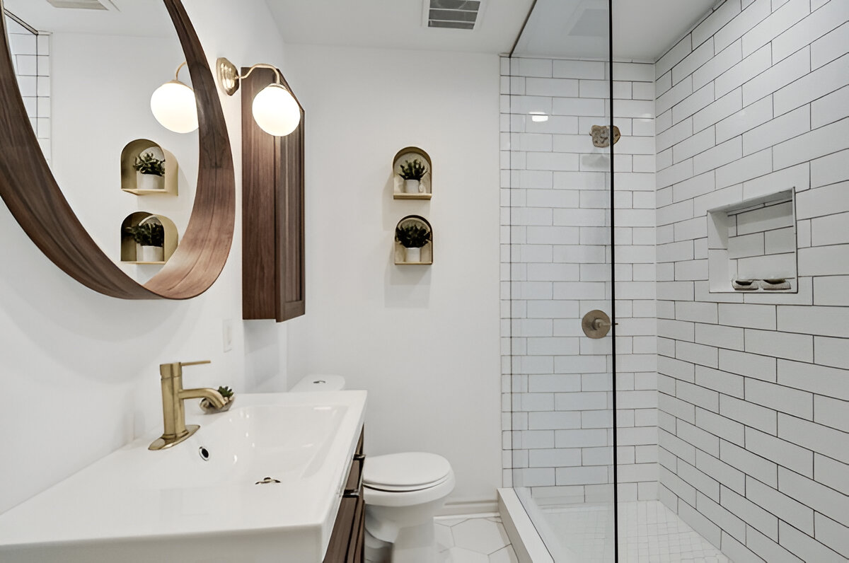 Minimalist bathroom with white subway tile shower and wood accents 