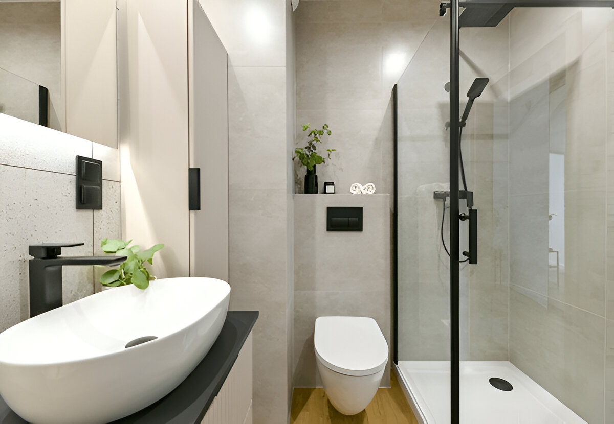 Minimalist small bathroom with walk-in shower and black fixtures 