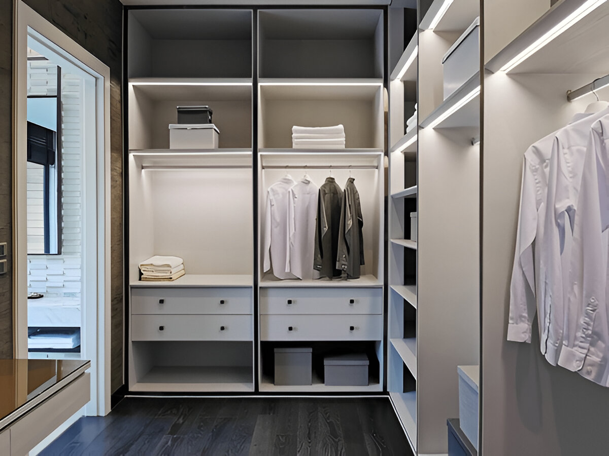 Modern minimalist walk-in closet with white shelving