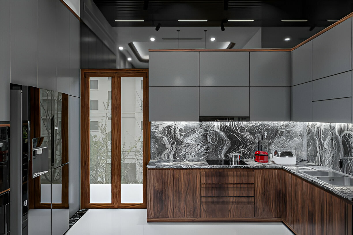 Luxury kitchen with grey cabinets and marble backsplash