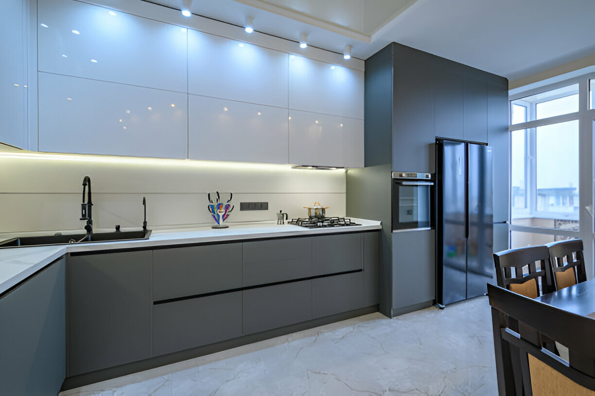 Sleek modern kitchen with matte gray lower cabinets and glossy white uppers
