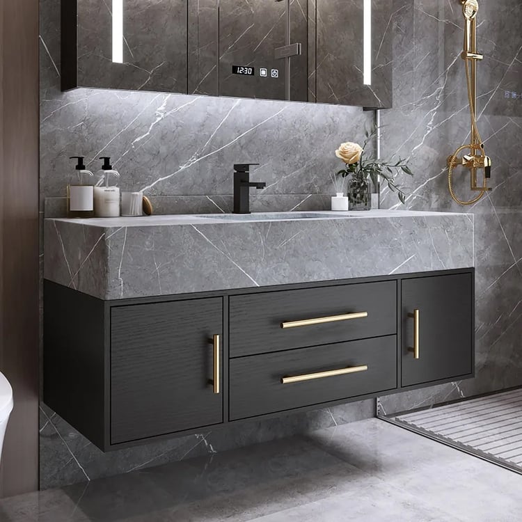Contemporary bathroom featuring a floating black vanity with gold handles, gray marble wall, LED mirror, and matte black faucet