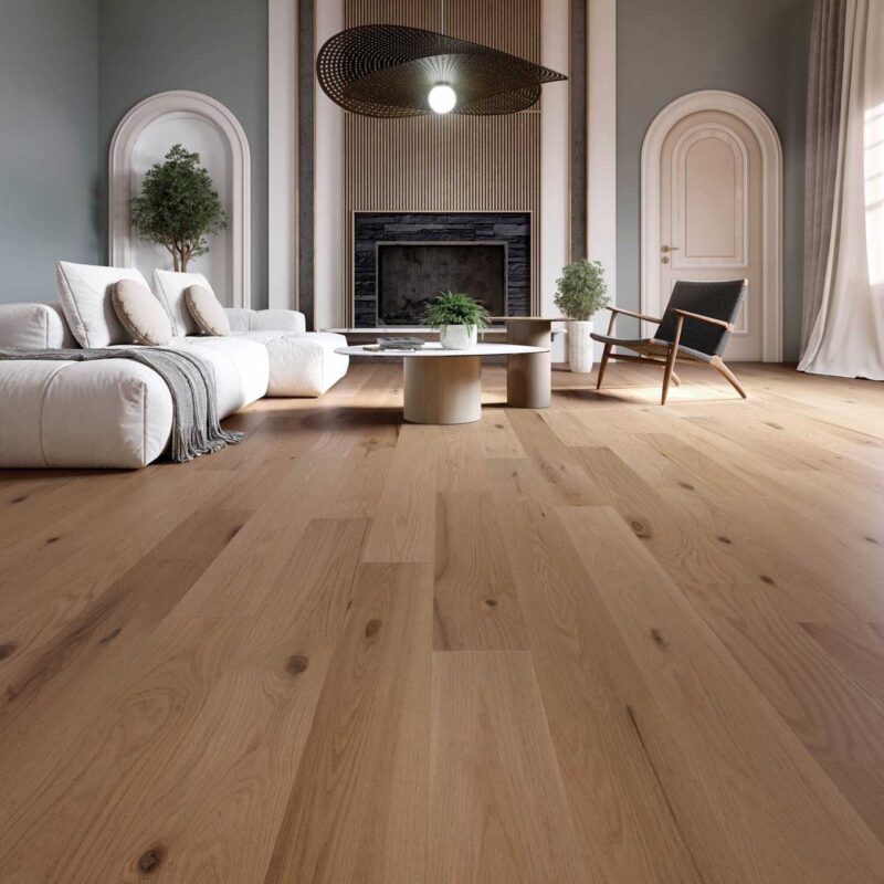 Spacious living room featuring light oak hardwood flooring, white modular sofa, round coffee tables, and arched doorway design