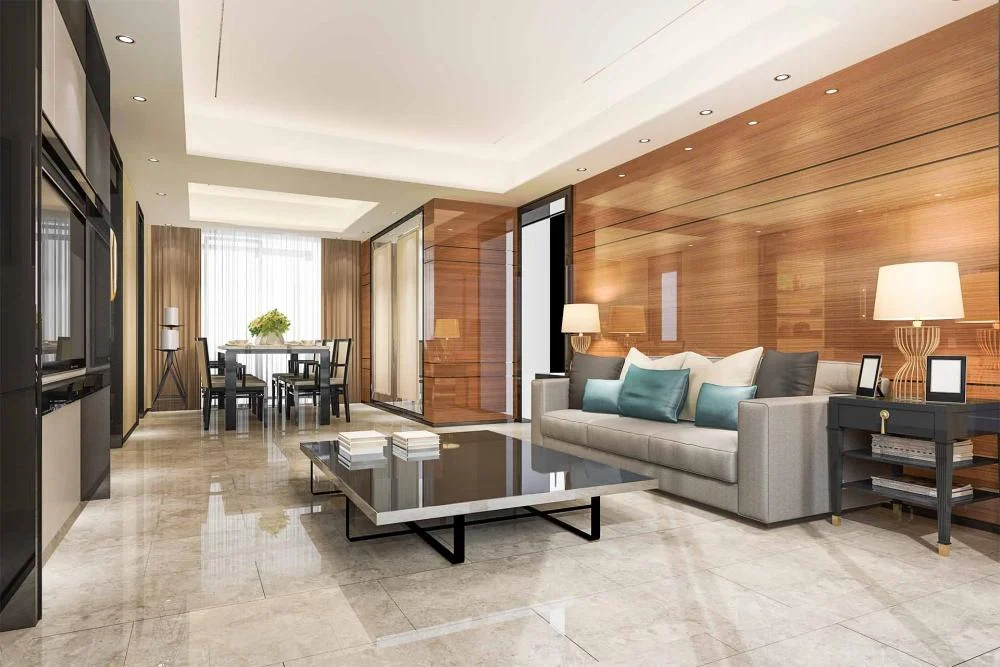Contemporary living room featuring glossy light oak veneer wall panels, grey sofa with teal cushions, marble flooring, and modern dining area