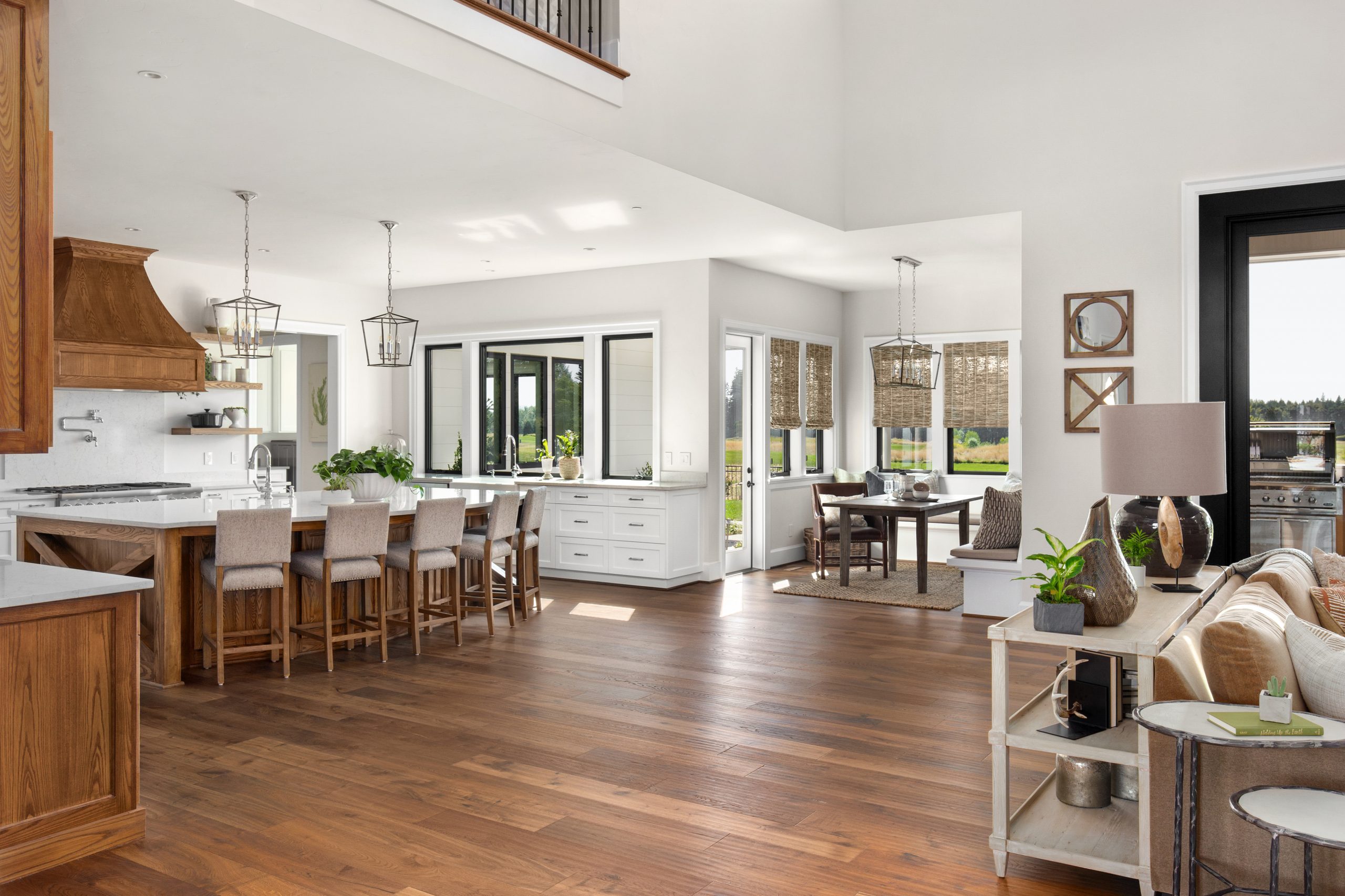 High-quality custom kitchen cabinets with a sophisticated, modern design from the MDC Design Center. A minimalist, open-concept kitchen with sleek, handleless cabinets in a warm, matte white finish. The cabinets seamlessly integrate with the surrounding architecture, creating a harmonious, visually appealing space. Indirect lighting casts a soft, ambient glow, highlighting the clean lines and subtle textures of the cabinetry. The kitchen island features a stylish, quartz countertop that contrasts beautifully with the cabinet colors. The overall aesthetic is one of understated elegance and timeless design, perfectly suited for the "Innovative Cabinet Design Solutions" section of the article.