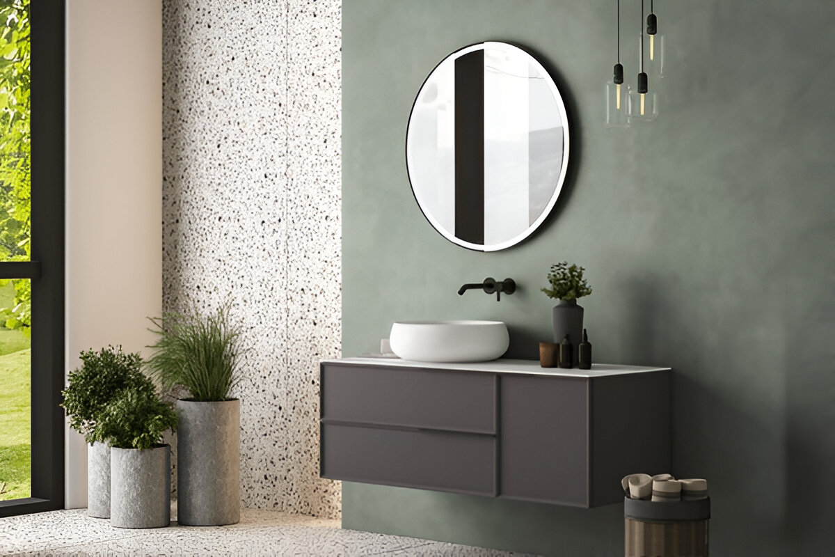Bright modern bathroom with double vanity, round mirrors, white cabinetry and toilet.