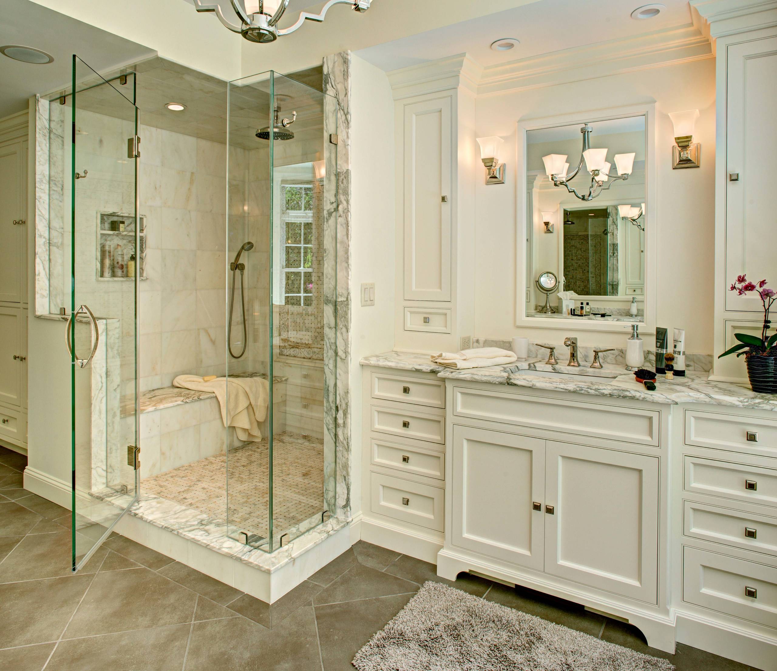 Luxury bathroom with marble shower and vanity design.